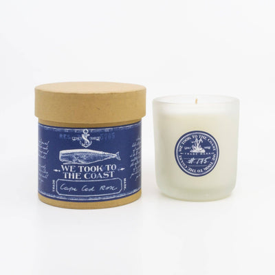 Candle with a blue label and wooden lid on a white background. we took to the caost